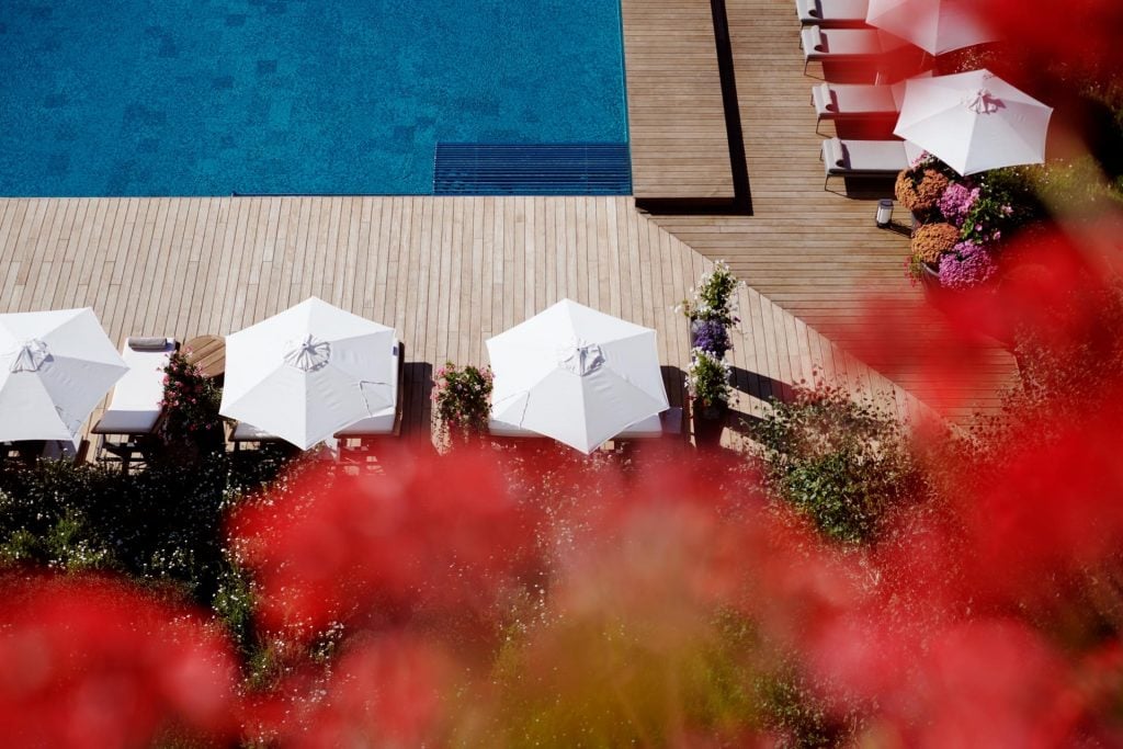 The Alpina gstaad pool switzerland